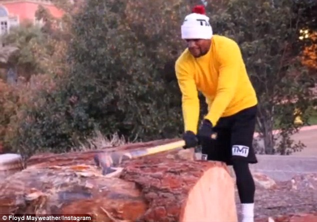 26B0CC0700000578-2996761-Floyd_Mayweather_chops_wood_as_he_prepares_to_take_on_M.jpg