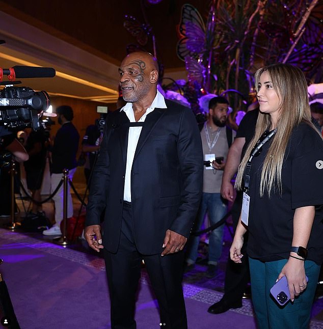 79536101-12831495-Takimoglu_pictured_alongside_Mike_Tyson_at_the_Battle_of_the_B.jpg