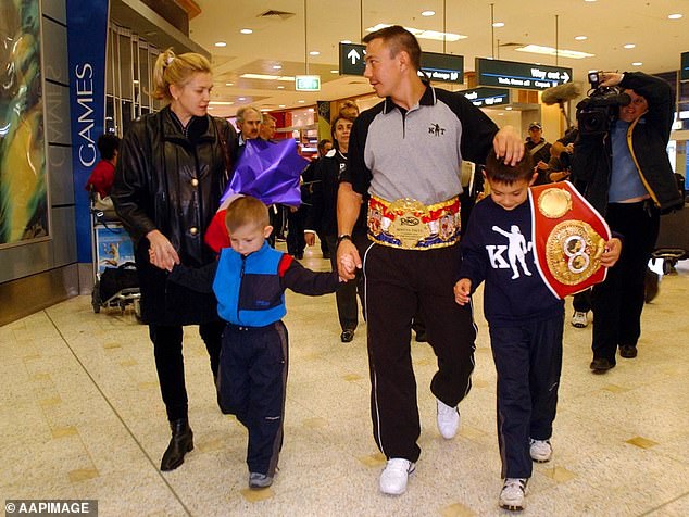 93894897-14264913-Nikita_and_Tim_pictured_with_their_dad_Kostya_and_mum_Natasha_.jpg